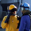 Helo deck crewmen waiting for a shift